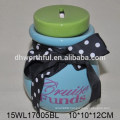 Blue ceramic money pot with black bowknot